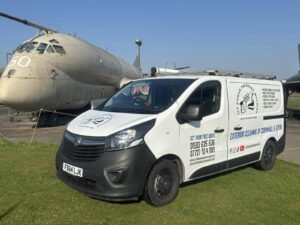 The Jet Power Pressure Washing van in front of a RAF Nimrod